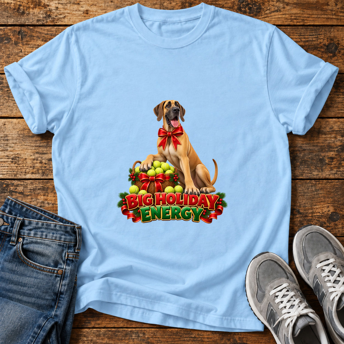 Big Holiday Energy Great Dane graphic T-shirt in Light Blue, shown on a flat-lay shirt mockup
