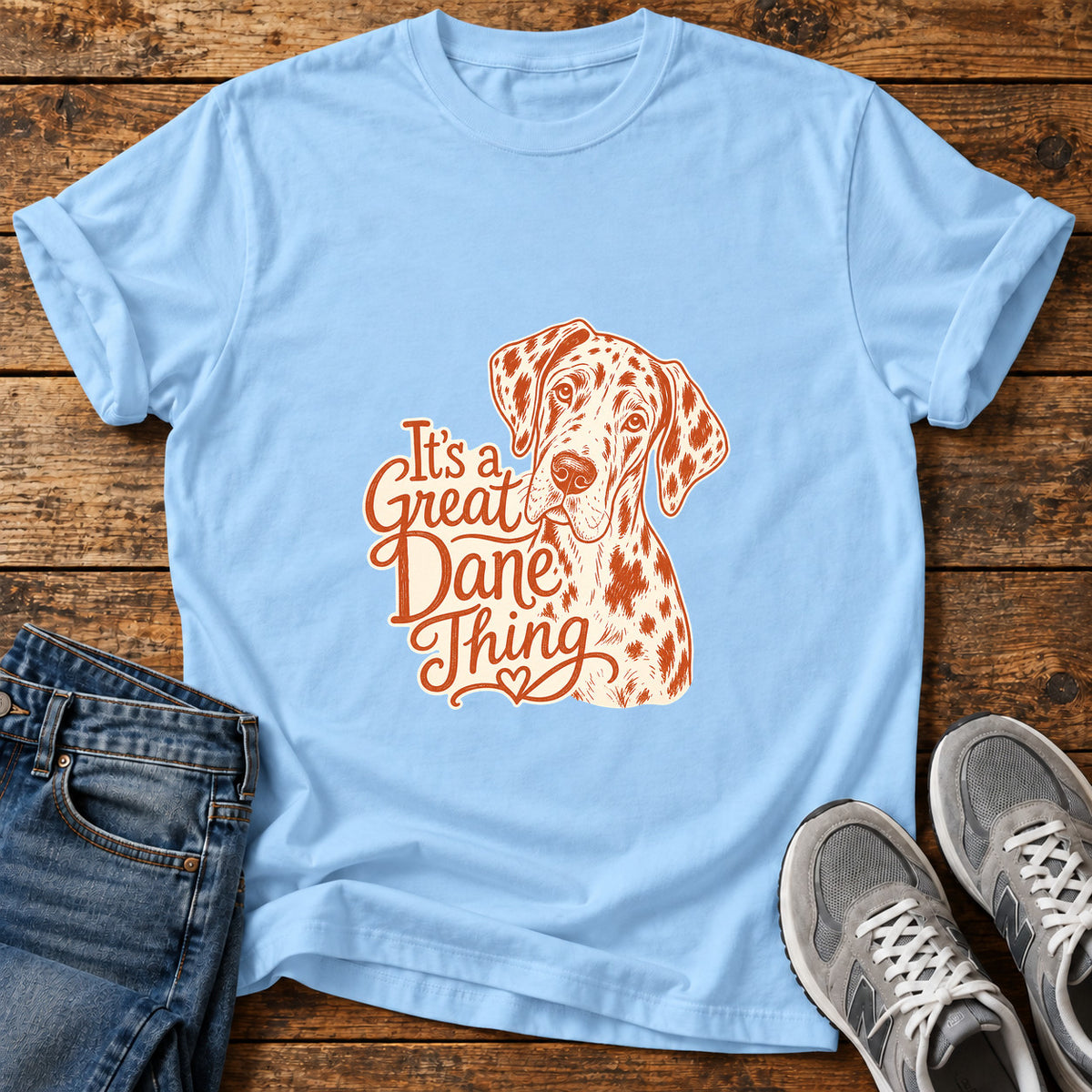 Great Dane Thing graphic T-shirt in Light Blue, shown on a flat-lay shirt mockup