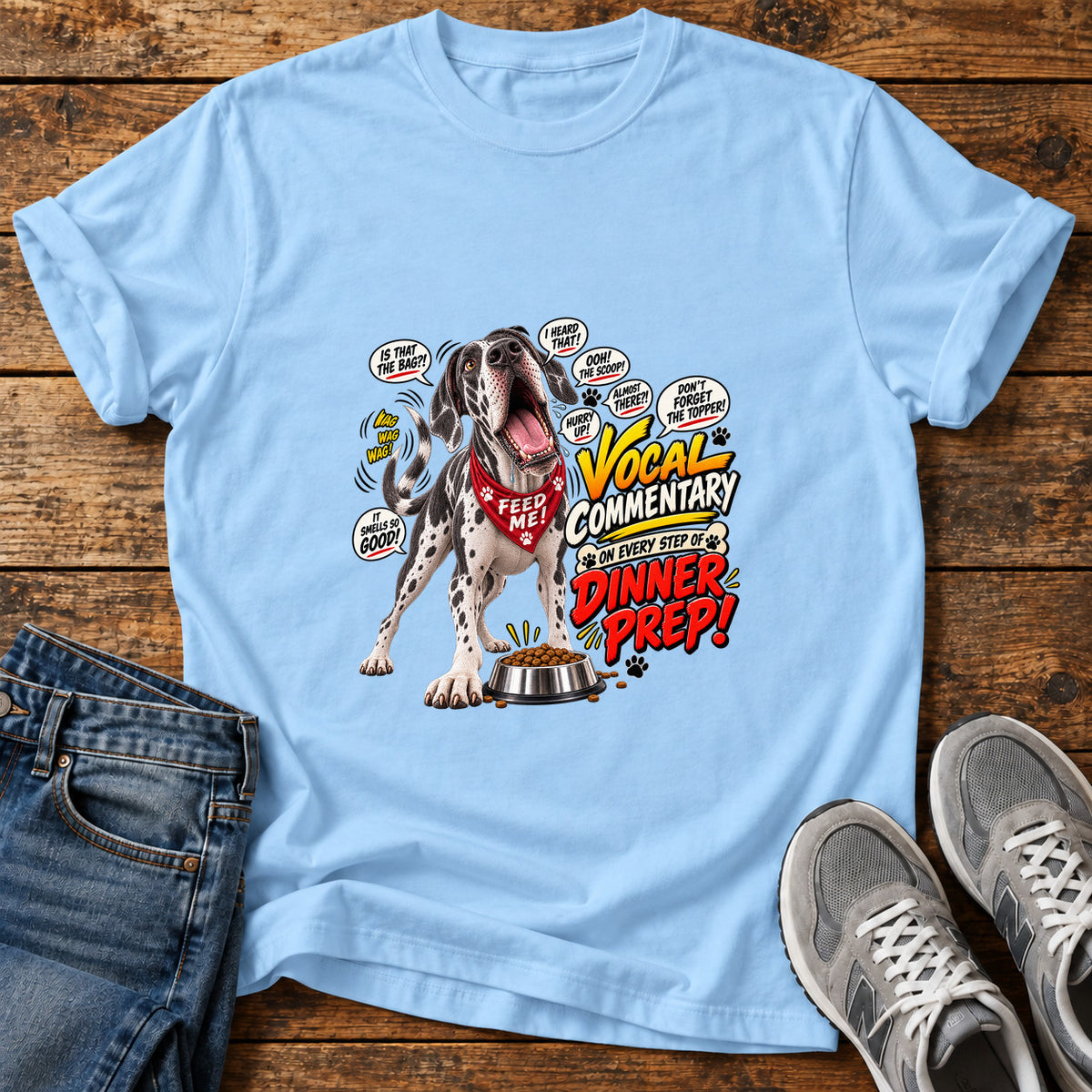 Dinner Prep Commentary Great Dane graphic T-shirt in Light Blue, shown on a flat-lay shirt mockup