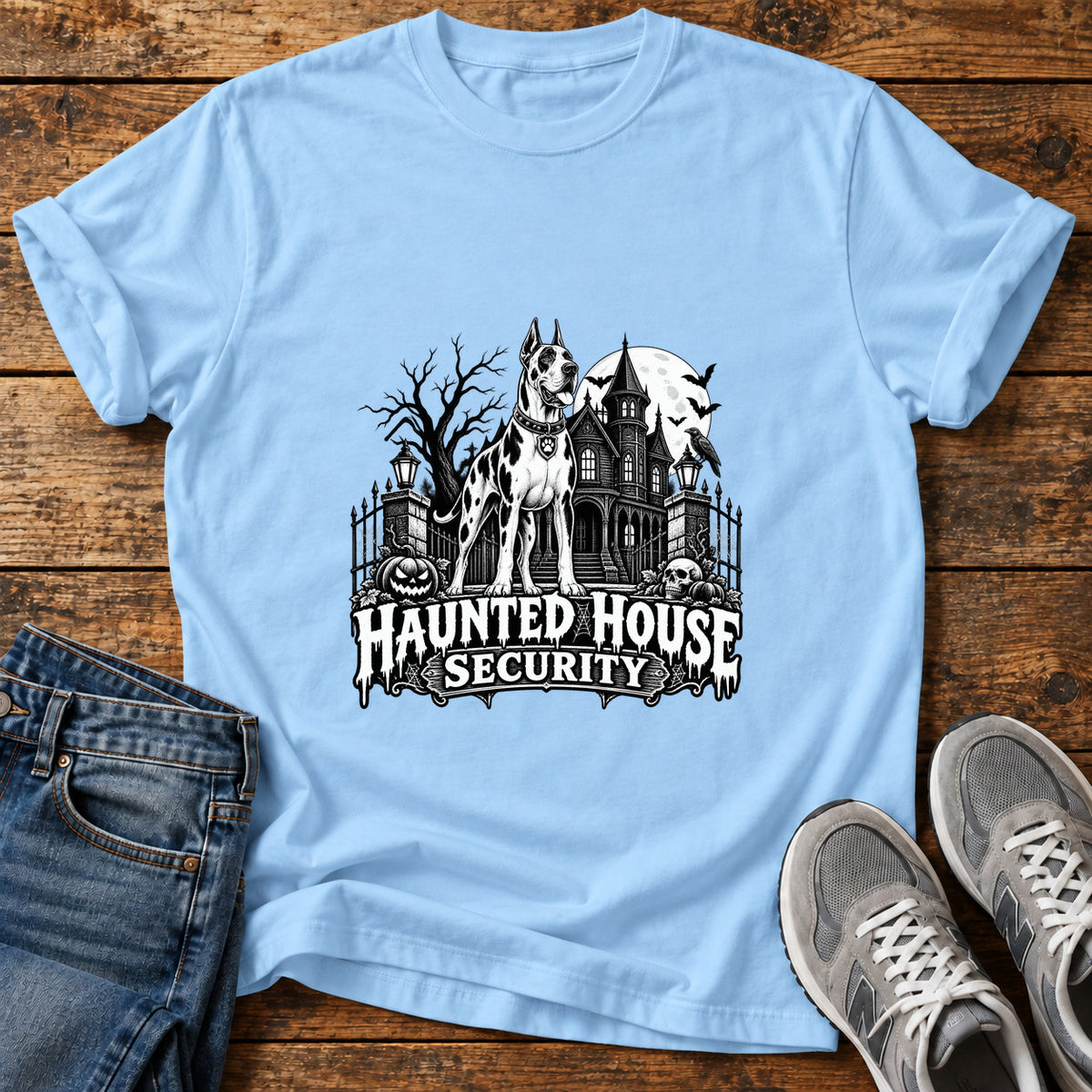 Haunted House Security Great Dane graphic T-shirt in Light Blue, shown on a flat-lay shirt mockup