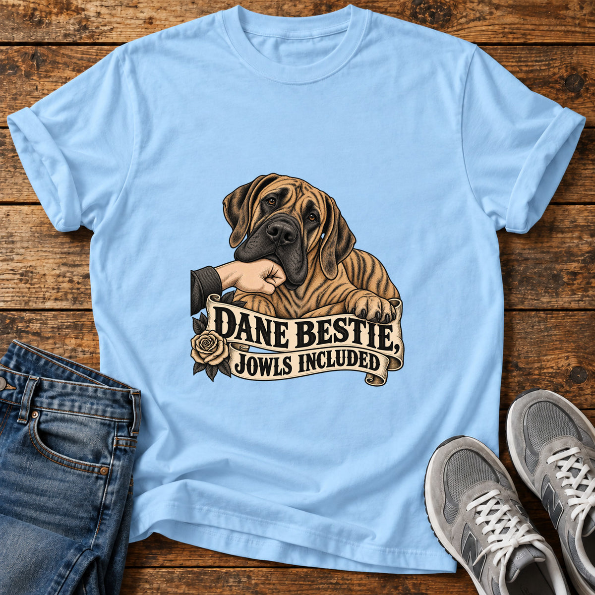 Dane Bestie Jowls Great Dane graphic T-shirt in Light Blue, shown on a flat-lay shirt mockup