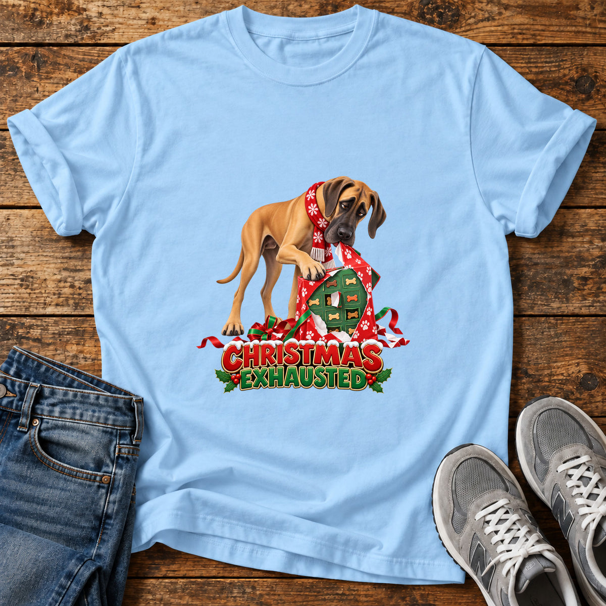 Christmas Exhausted Great Dane graphic T-shirt in Light Blue, shown on a flat-lay shirt mockup