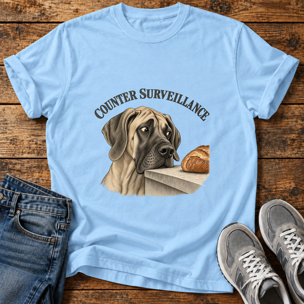 Counter Surveillance Great Dane graphic T-shirt in Light Blue, shown on a flat-lay shirt mockup