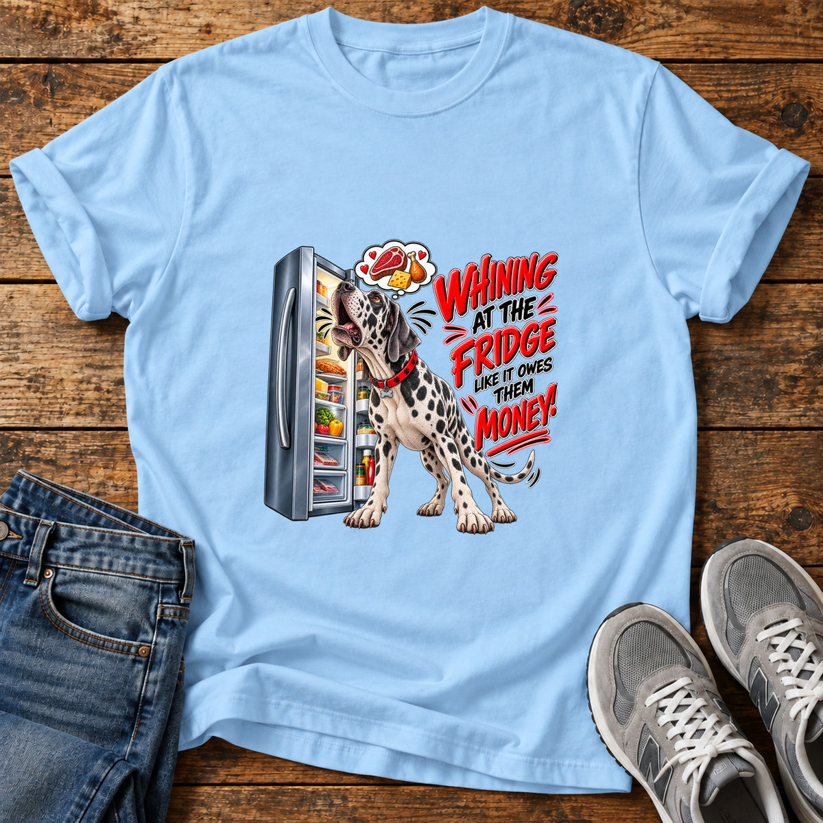 Whining Fridge Dog Great Dane graphic T-shirt in Light Blue, shown on a flat-lay shirt mockup