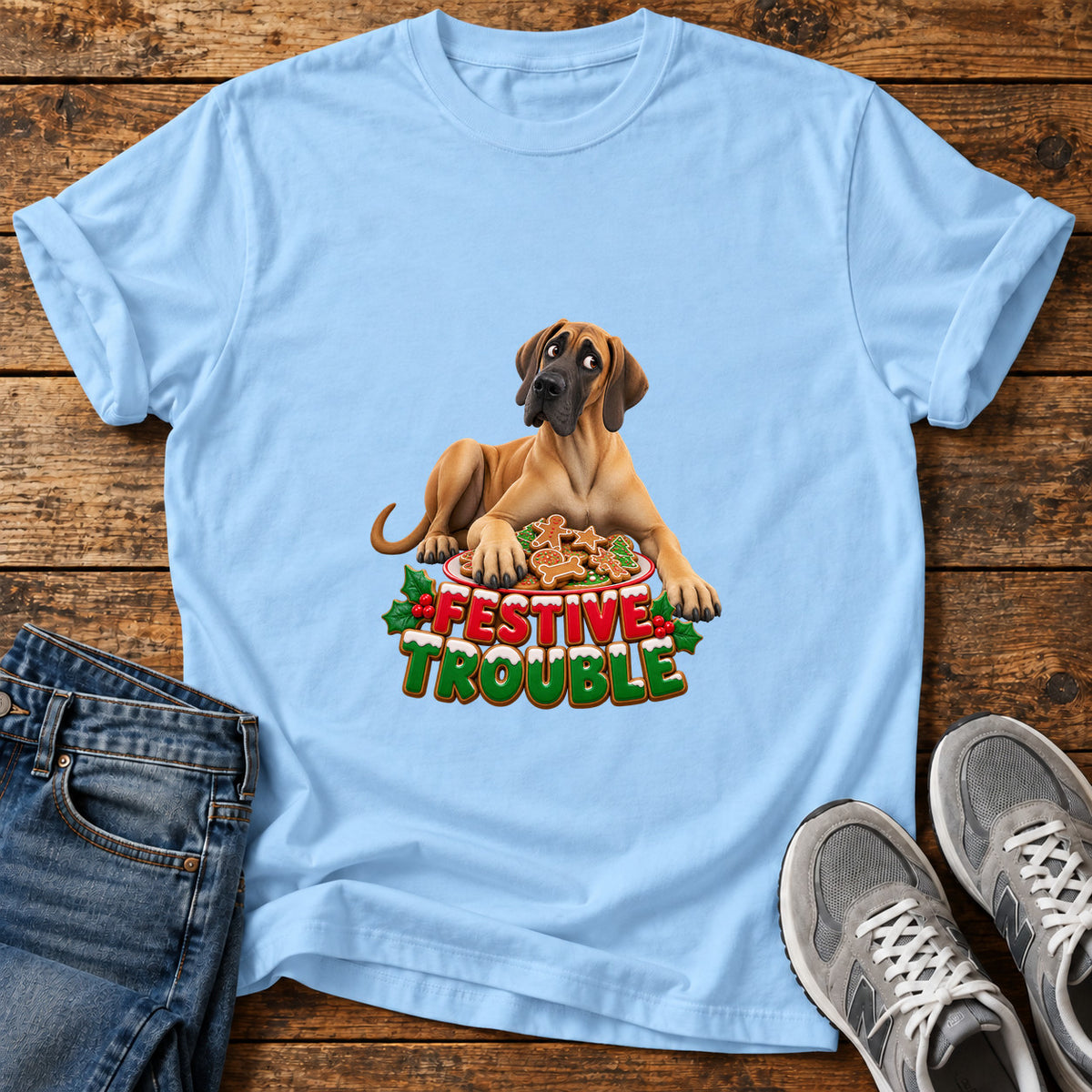 Festive Trouble Great Dane graphic T-shirt in Light Blue, shown on a flat-lay shirt mockup