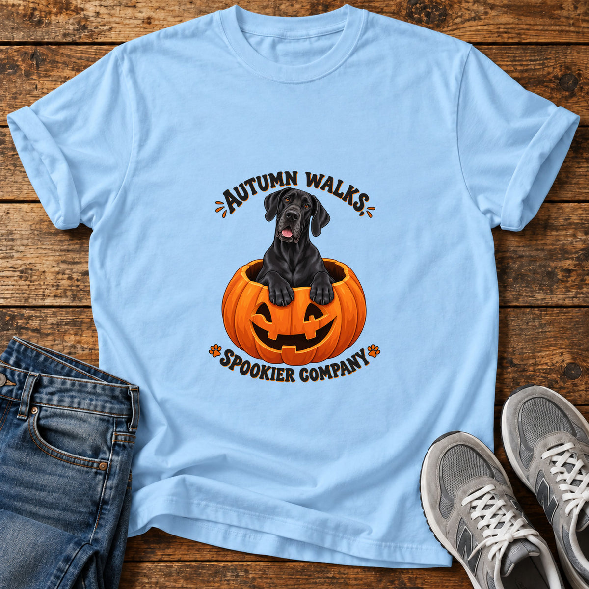 Autumn Walks Great Dane graphic T-shirt in Light Blue, shown on a flat-lay shirt mockup