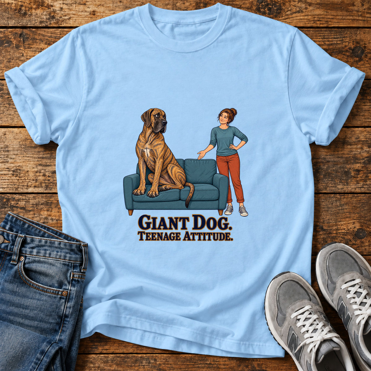 Giant Dog Attitude Great Dane graphic T-shirt in Light Blue, shown on a flat-lay shirt mockup