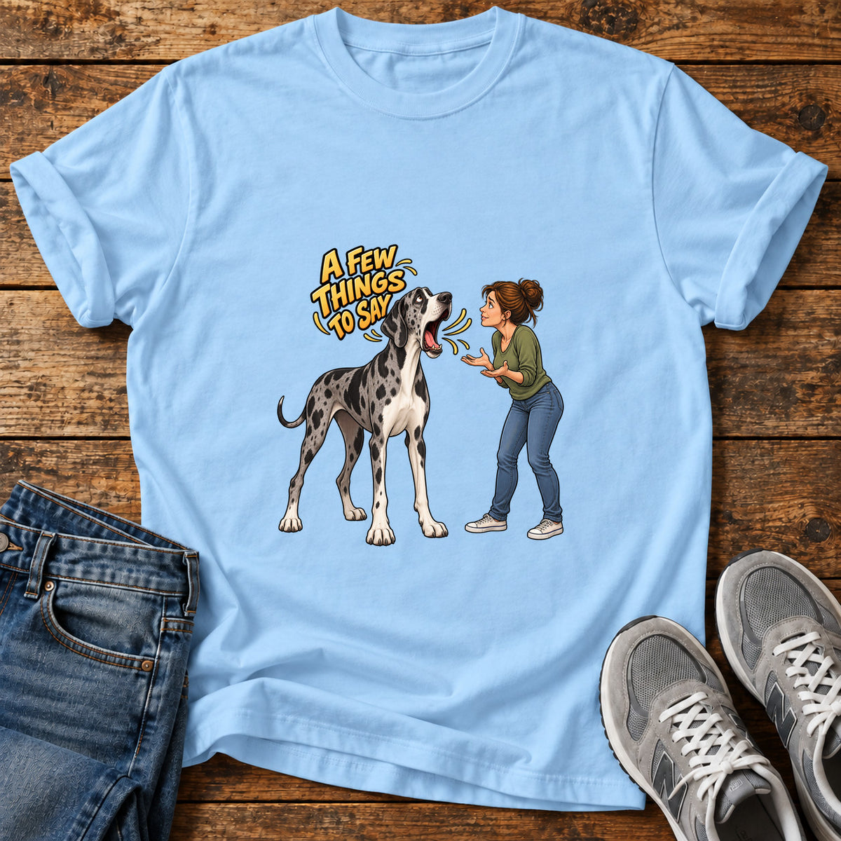 A Few Things Great Dane graphic T-shirt in Light Blue, shown on a flat-lay shirt mockup