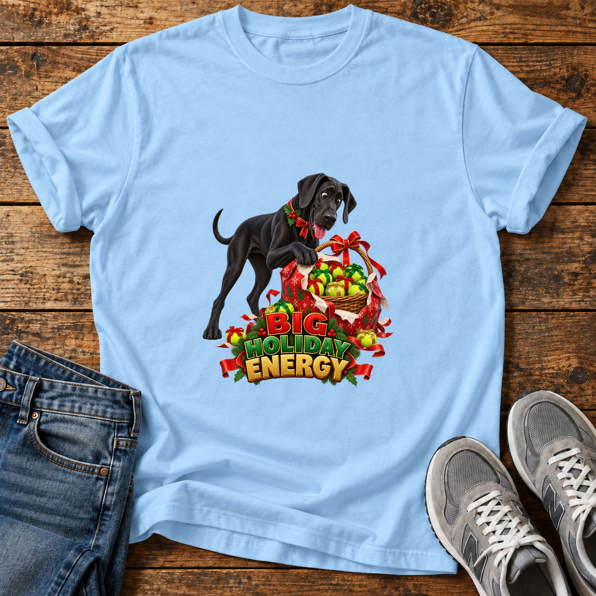 Big Holiday Energy Great Dane graphic T-shirt in Light Blue, shown on a flat-lay shirt mockup