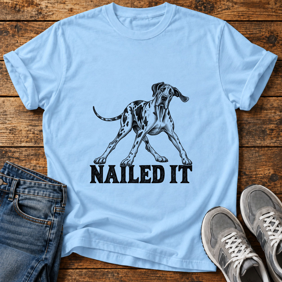 Nailed It Great Dane graphic T-shirt in Light Blue, shown on a flat-lay shirt mockup
