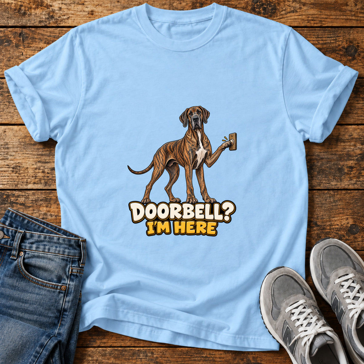 Doorbell Guardian Great Dane graphic T-shirt in Light Blue, shown on a flat-lay shirt mockup