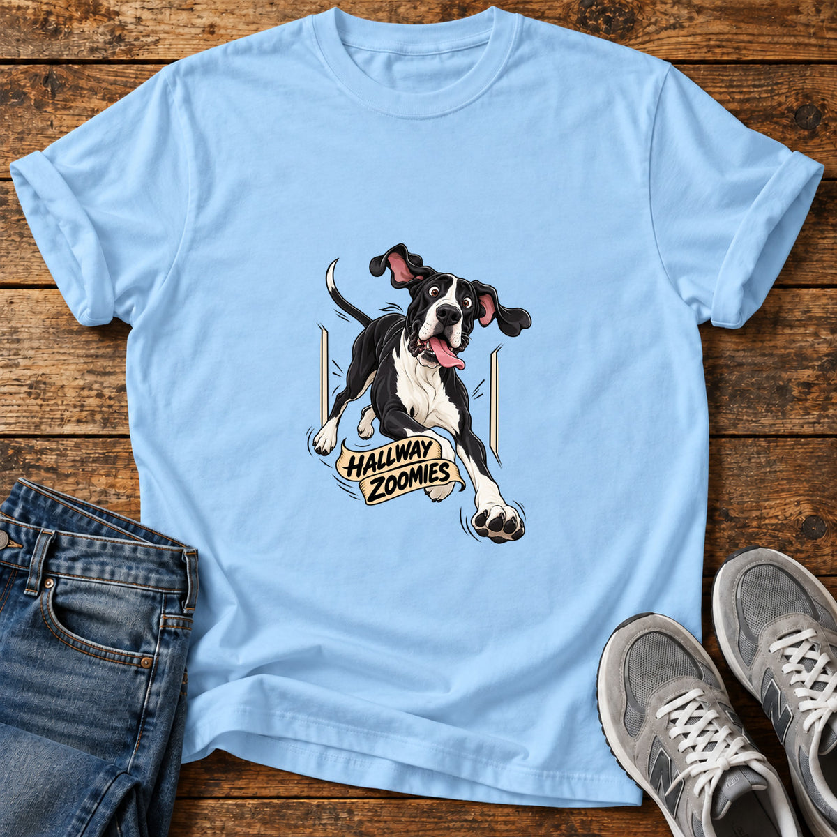Hallway Zoomies Great Dane graphic T-shirt in Light Blue, shown on a flat-lay shirt mockup