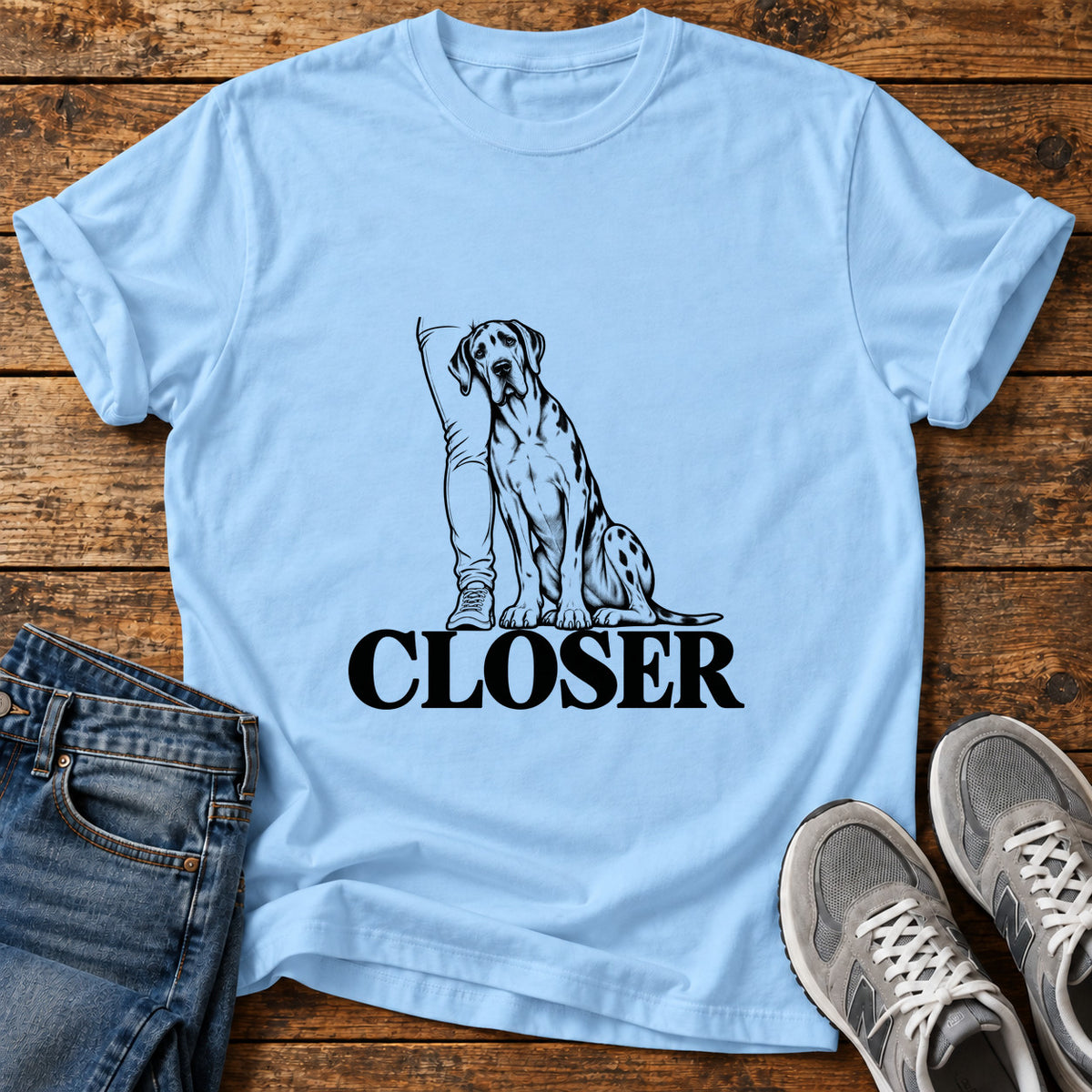 Closer Paws Great Dane graphic T-shirt in Light Blue, shown on a flat-lay shirt mockup