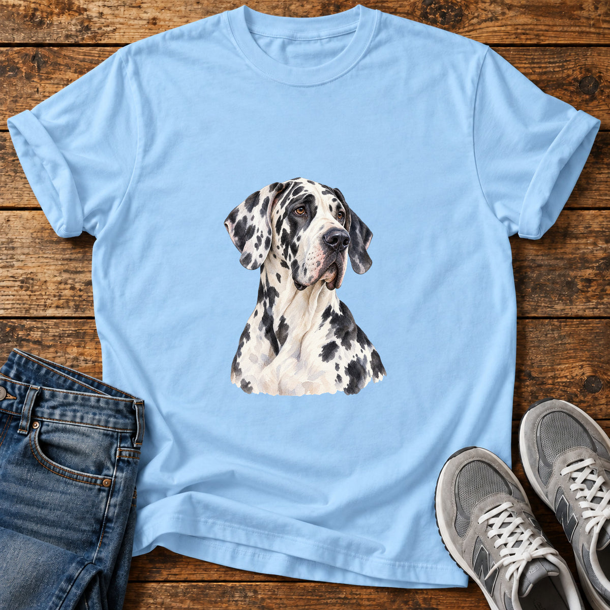 Spotted Majesty Great Dane graphic T-shirt in Light Blue, shown on a flat-lay shirt mockup