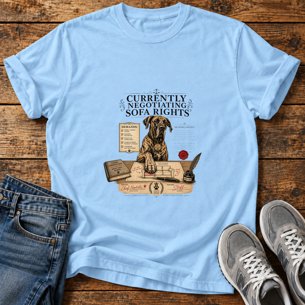 Sofa Rights Negotiation Great Dane graphic T-shirt in Light Blue, shown on a flat-lay shirt mockup