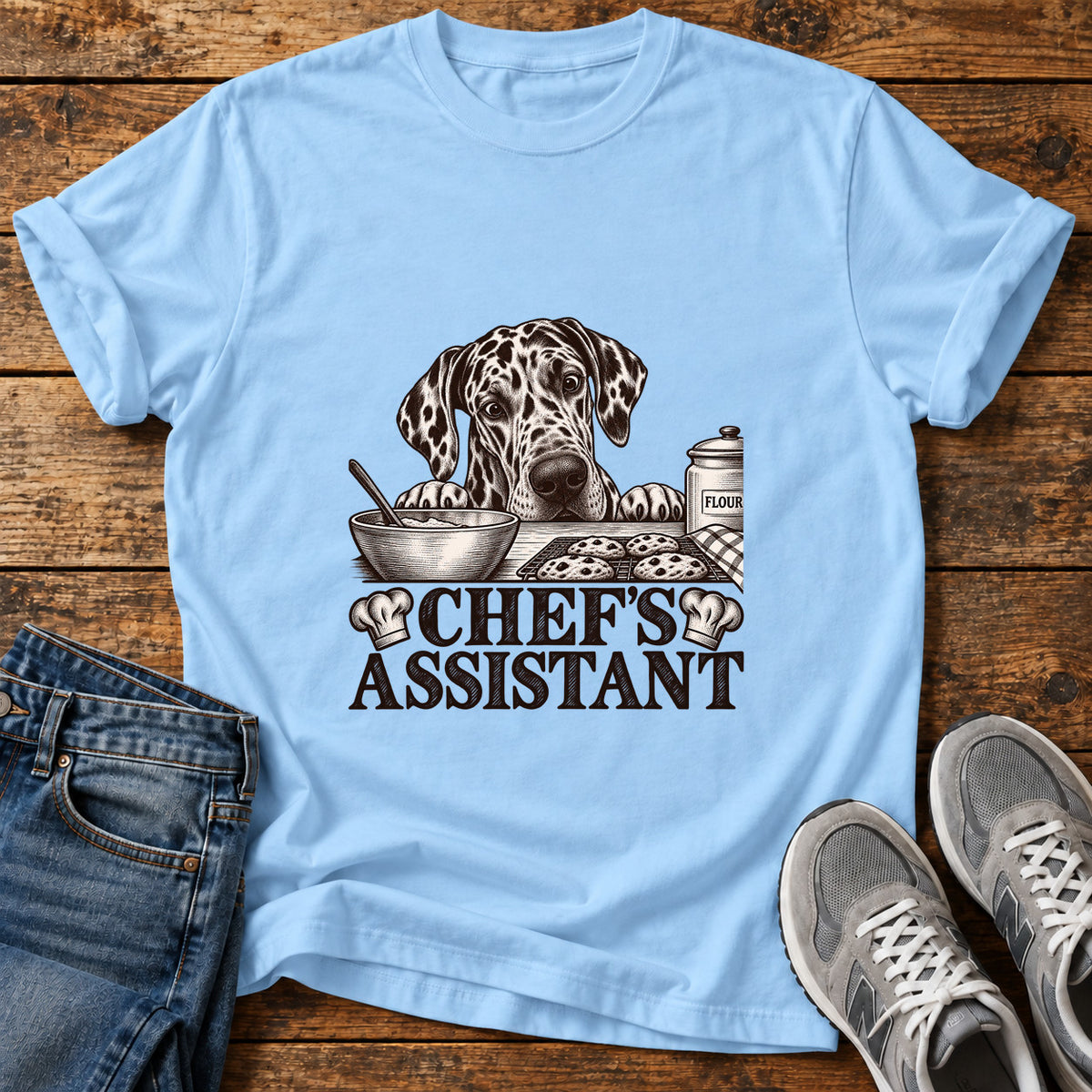 Chef's Assistant Great Dane graphic T-shirt in Light Blue, shown on a flat-lay shirt mockup