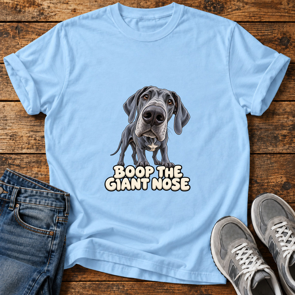 Boop Giant Nose Great Dane graphic T-shirt in Light Blue, shown on a flat-lay shirt mockup