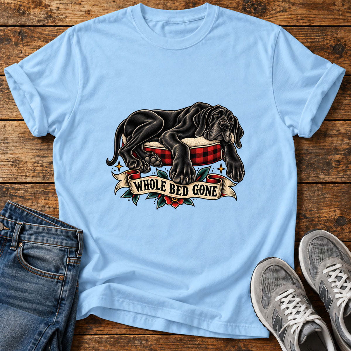 Whole Bed Gone Great Dane graphic T-shirt in Light Blue, shown on a flat-lay shirt mockup
