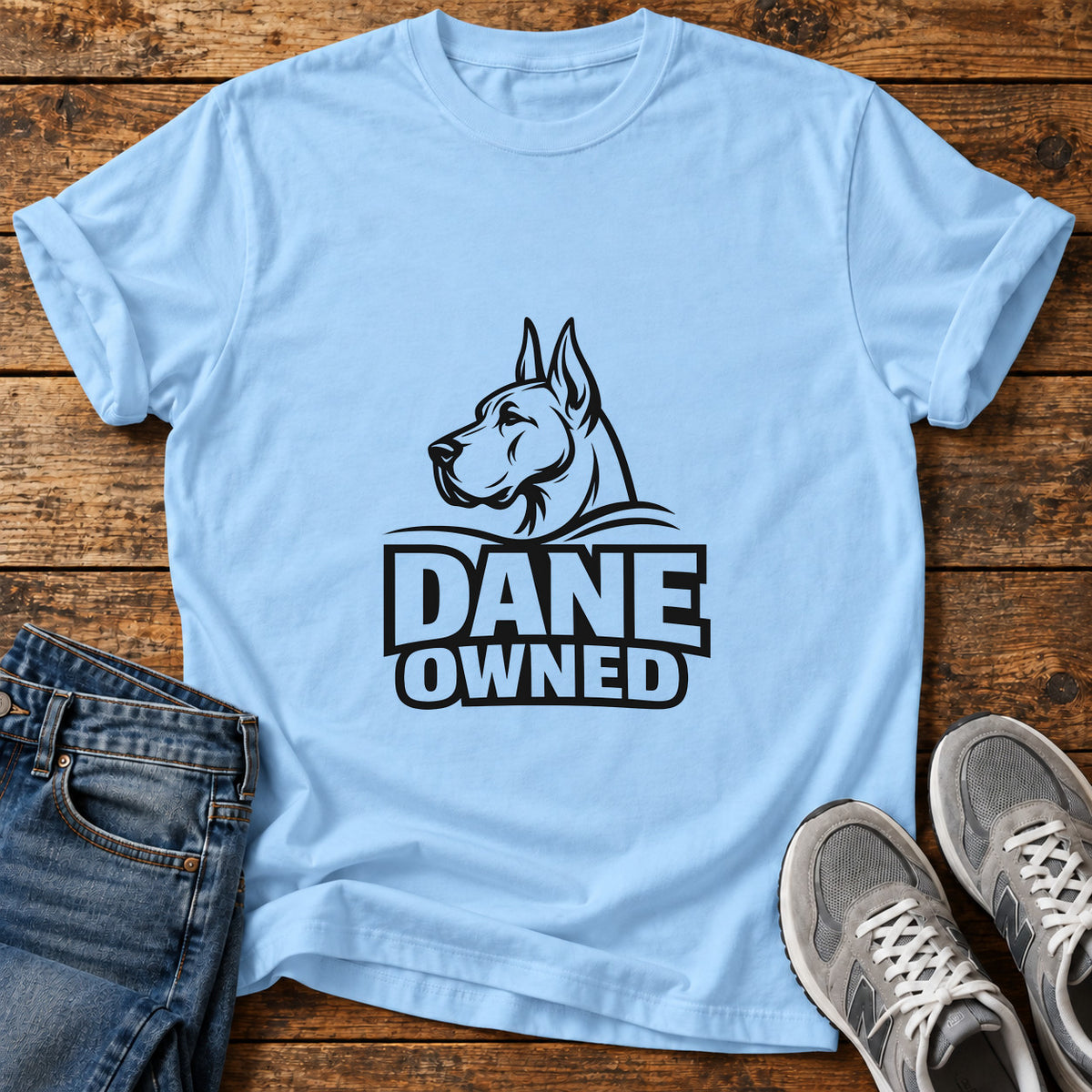 Dane Owned Great Dane graphic T-shirt in Light Blue, shown on a flat-lay shirt mockup