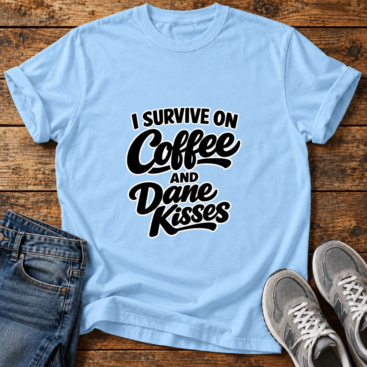 Coffee Dane Kisses Great Dane graphic T-shirt in Light Blue, shown on a flat-lay shirt mockup