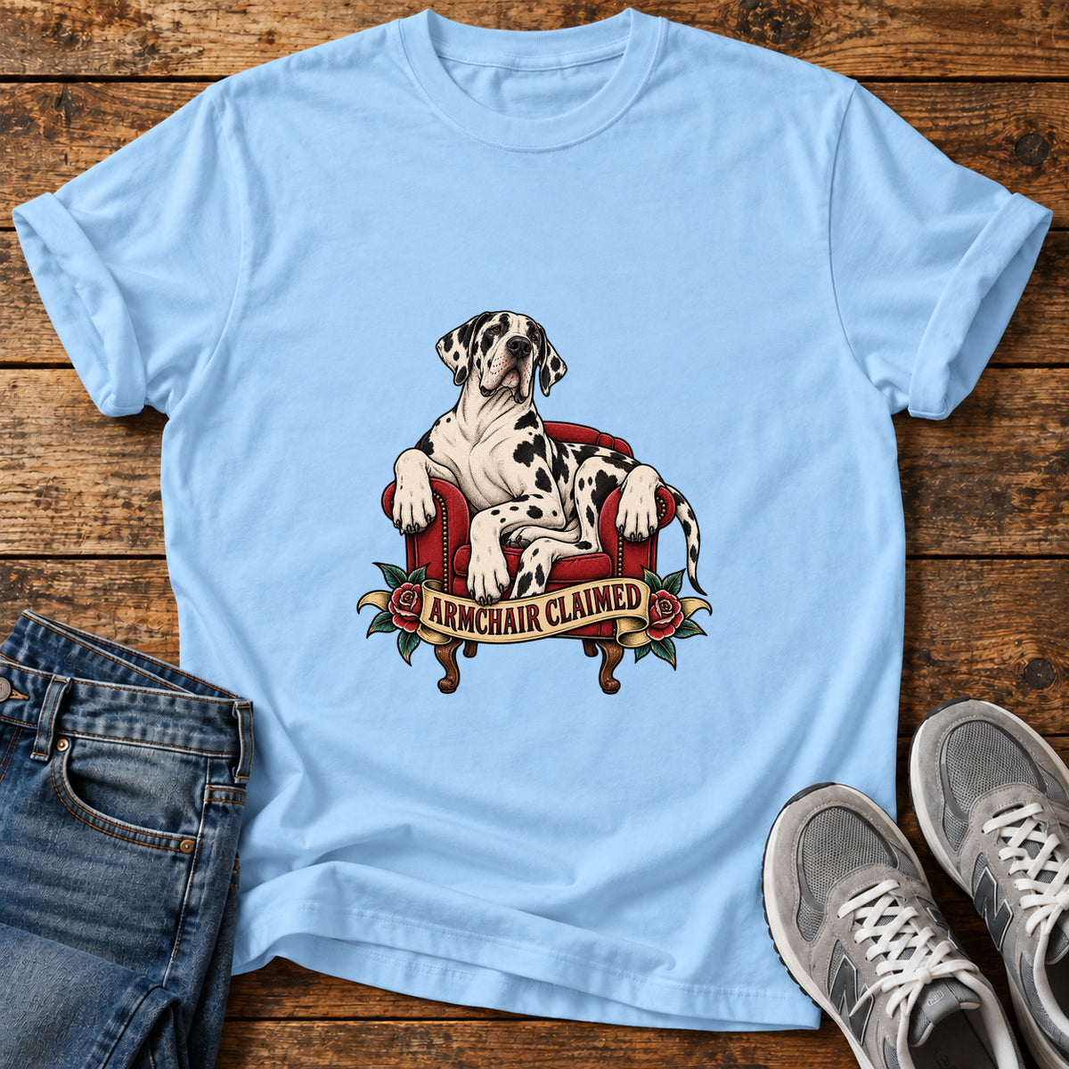 Armchair Claimed Great Dane graphic T-shirt in Light Blue, shown on a flat-lay shirt mockup