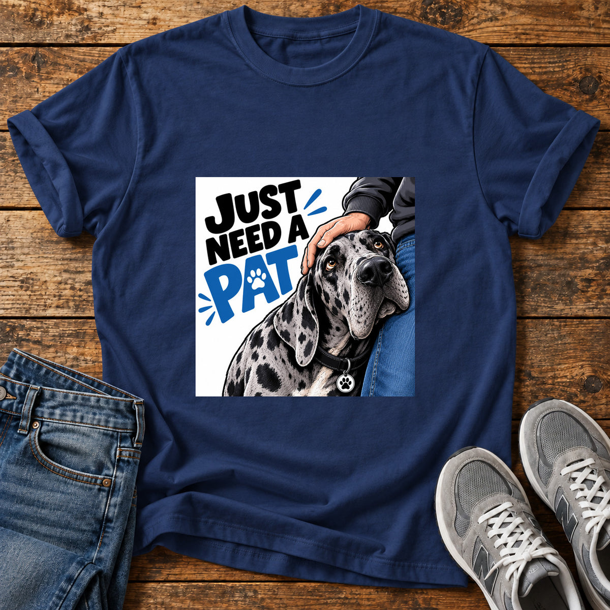 Just Need Pat Great Dane graphic T-shirt in Navy, shown on a flat-lay shirt mockup