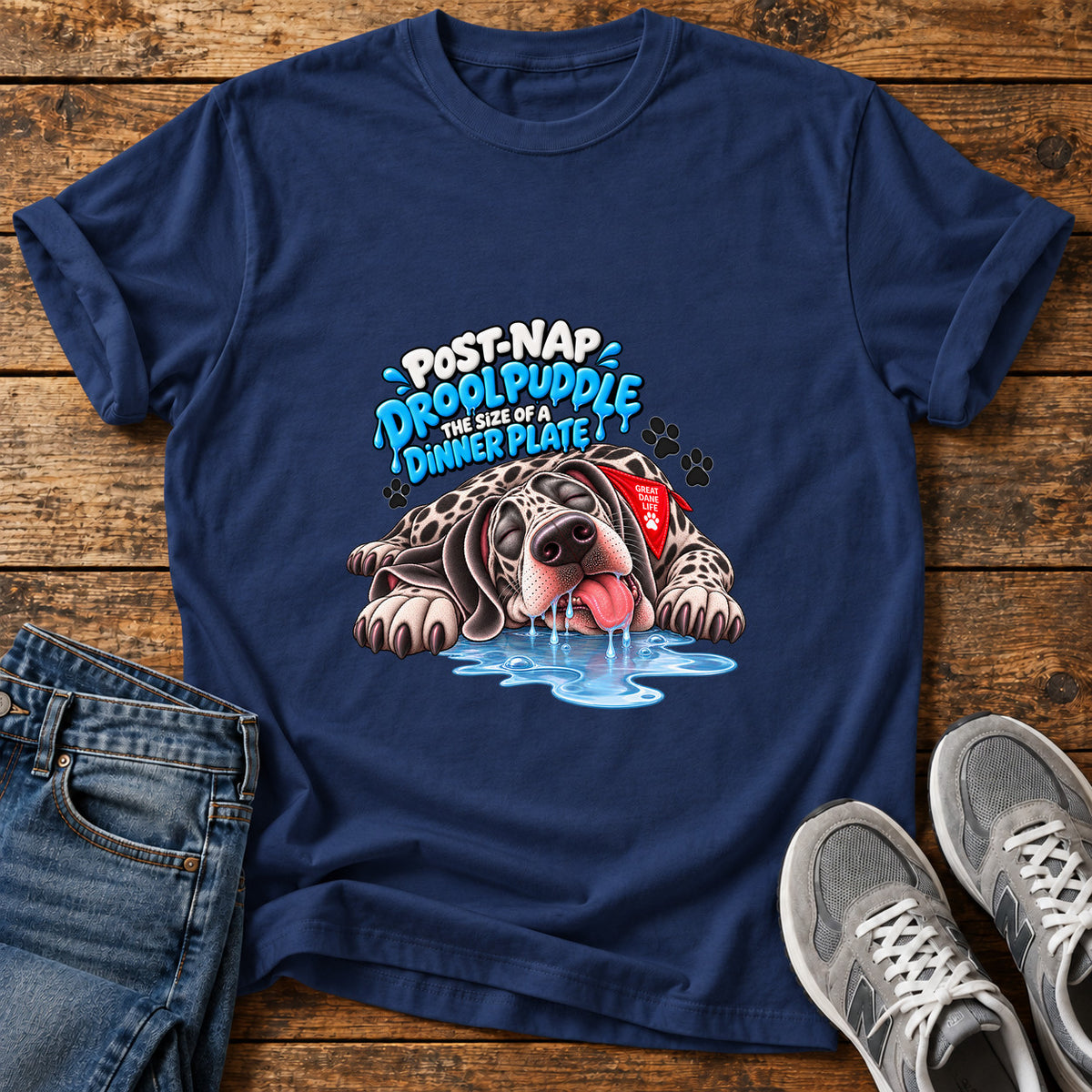 Drool Puddle Dog Great Dane graphic T-shirt in Navy, shown on a flat-lay shirt mockup