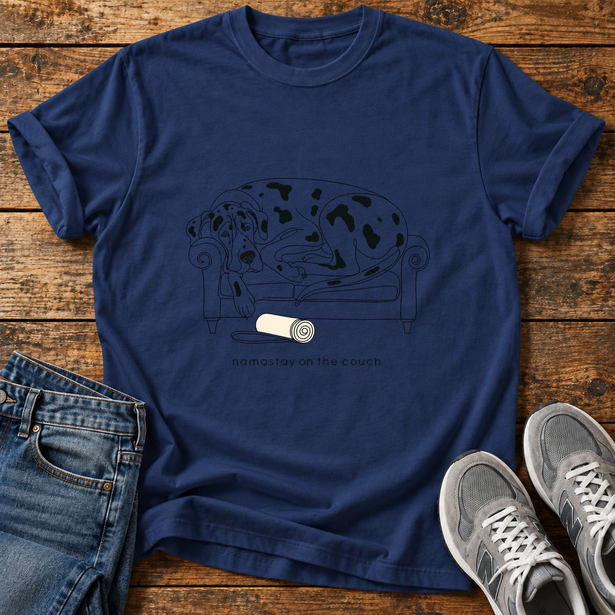 Namastay Couch Great Dane graphic T-shirt in Navy, shown on a flat-lay shirt mockup