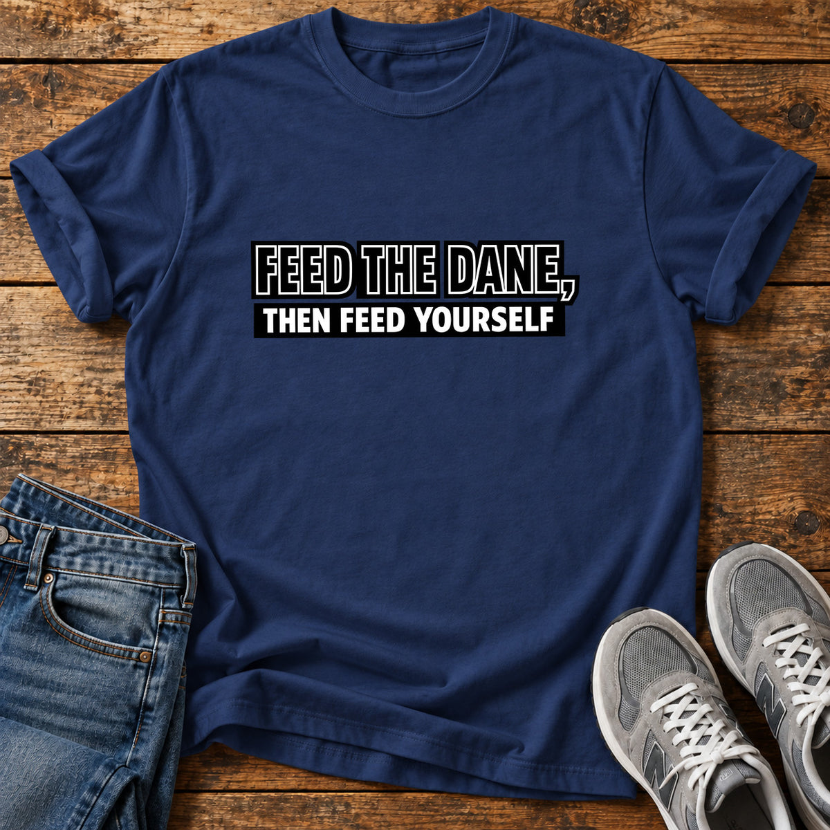 Feed The Dane Great Dane graphic T-shirt in Navy, shown on a flat-lay shirt mockup