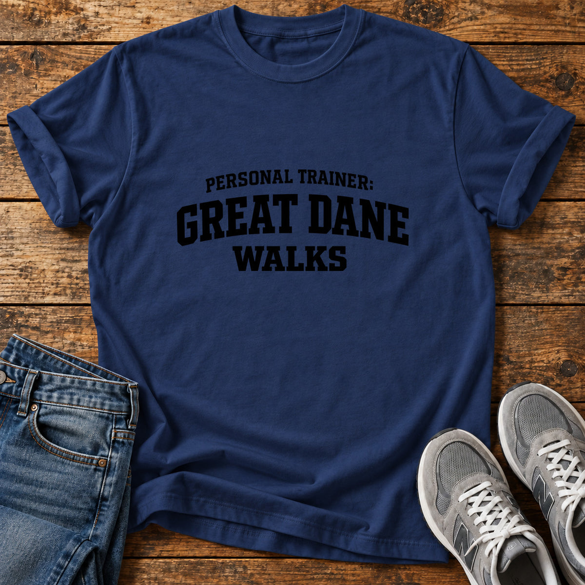 Great Dane Trainer graphic T-shirt in Navy, shown on a flat-lay shirt mockup