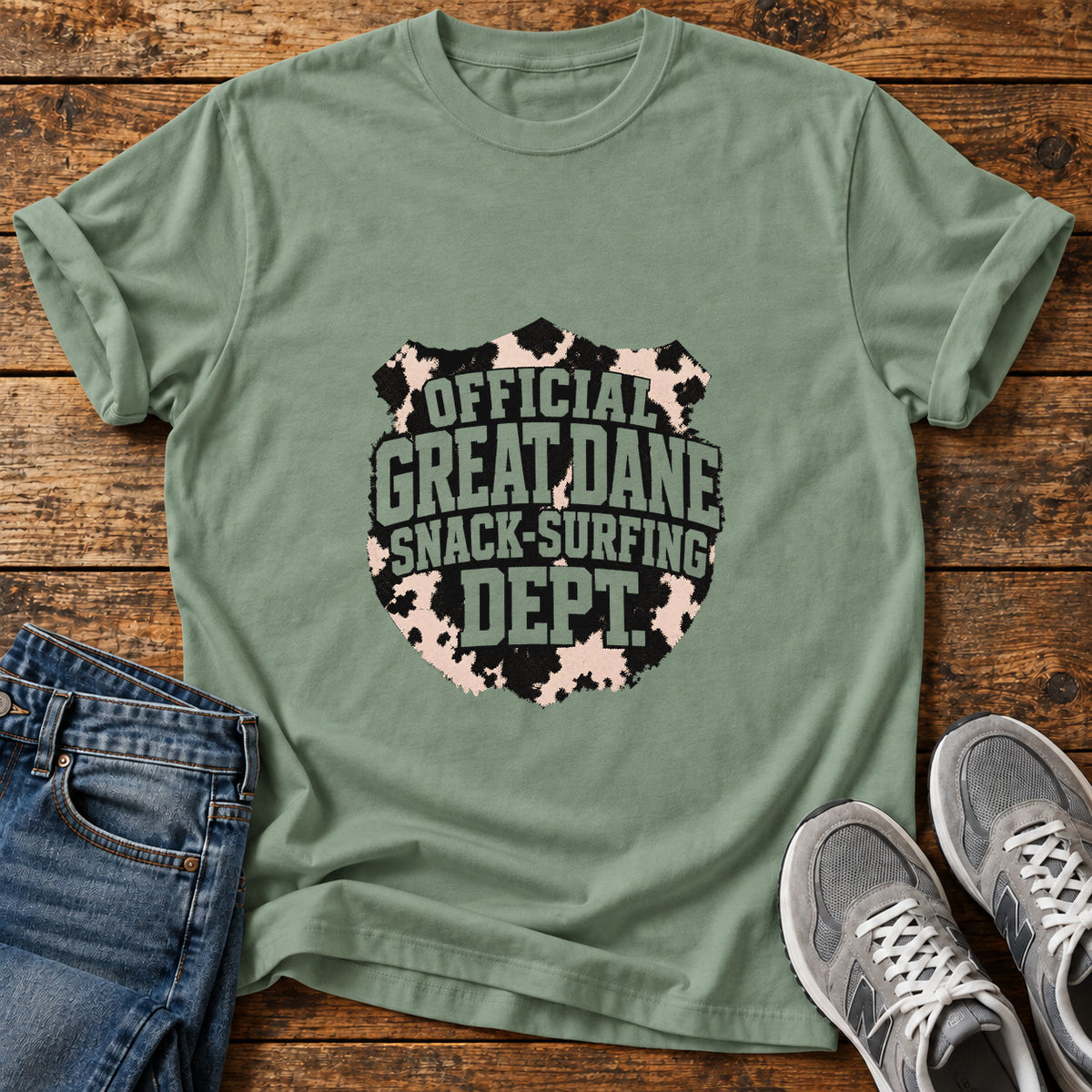 Snack-Surfing Dept Great Dane graphic T-shirt in Sage, shown on a flat-lay shirt mockup