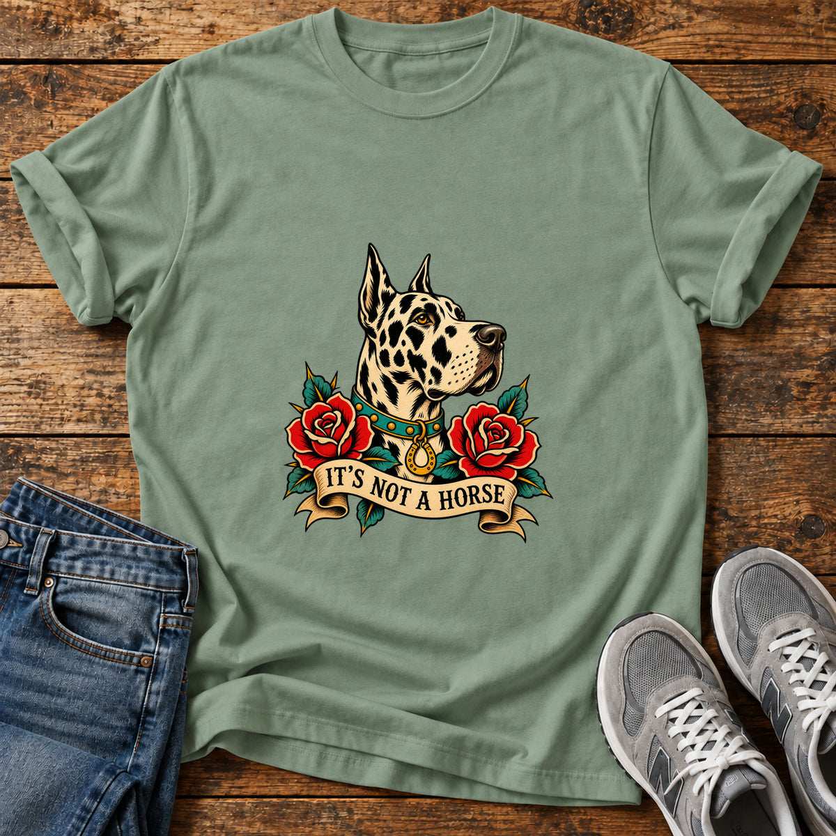 It's Not A Great Dane graphic T-shirt in Sage, shown on a flat-lay shirt mockup