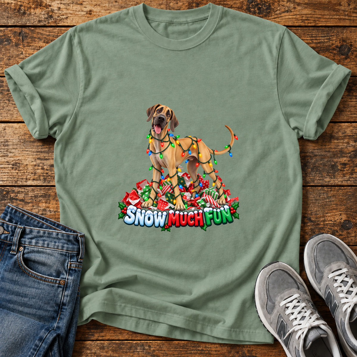 Snow Much Fun Great Dane graphic T-shirt in Sage, shown on a flat-lay shirt mockup