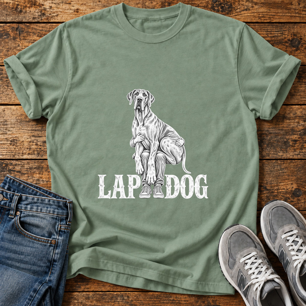 Lap Dog Great Dane graphic T-shirt in Sage, shown on a flat-lay shirt mockup