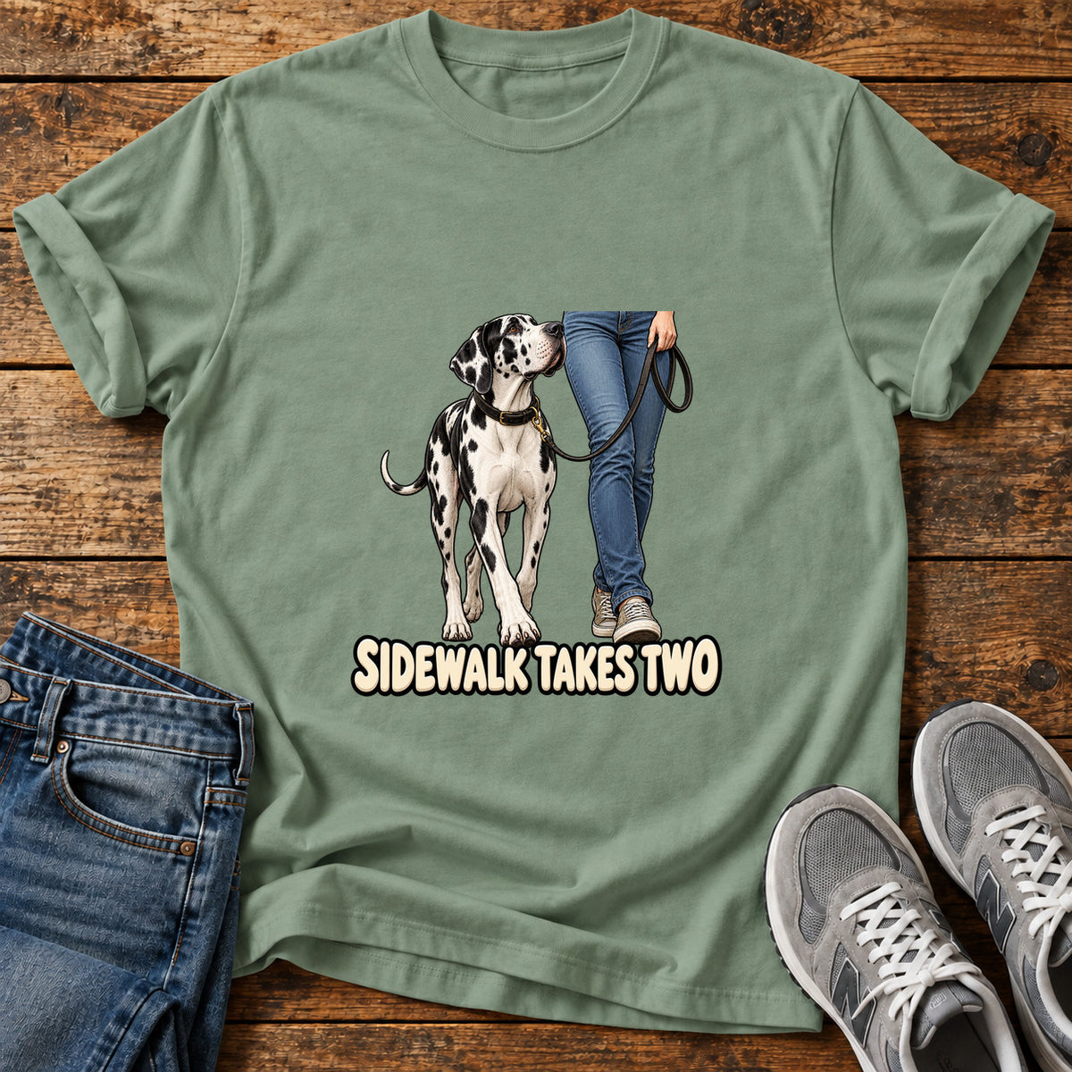 Sidewalk Takes Two Great Dane graphic T-shirt in Sage, shown on a flat-lay shirt mockup