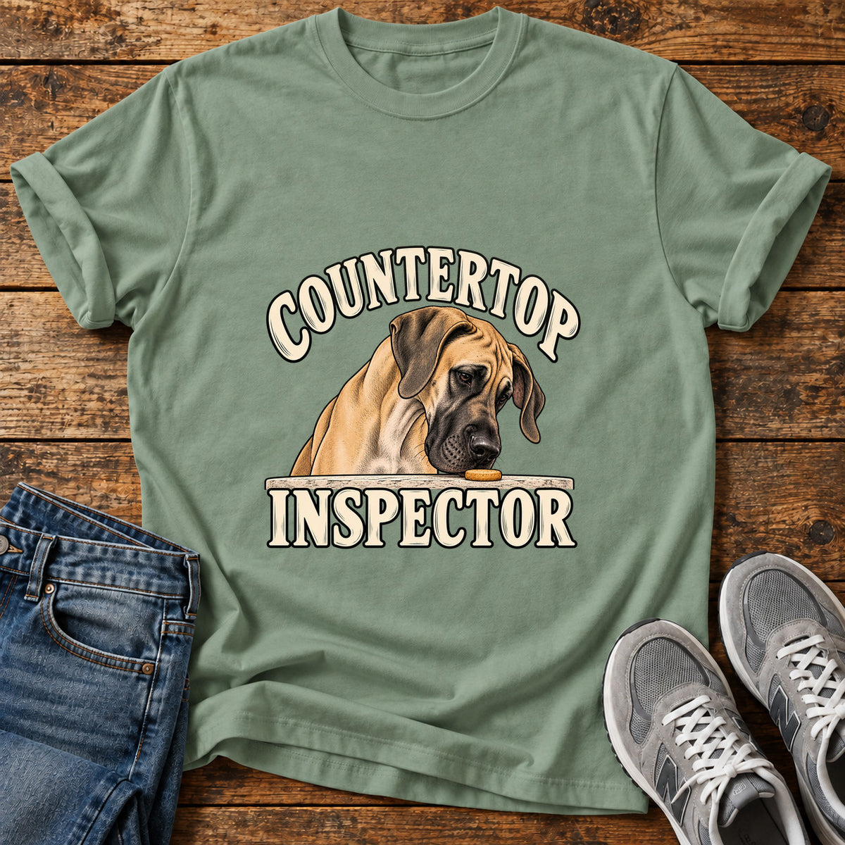 Countertop Inspector Great Dane graphic T-shirt in Sage, shown on a flat-lay shirt mockup