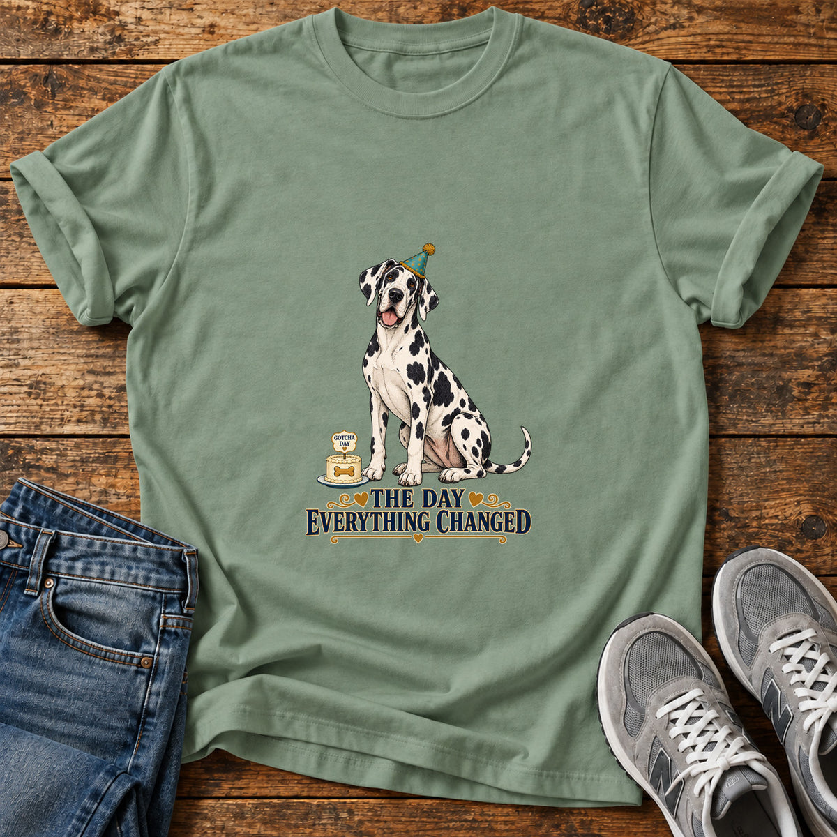 The Day Changed Great Dane graphic T-shirt in Sage, shown on a flat-lay shirt mockup