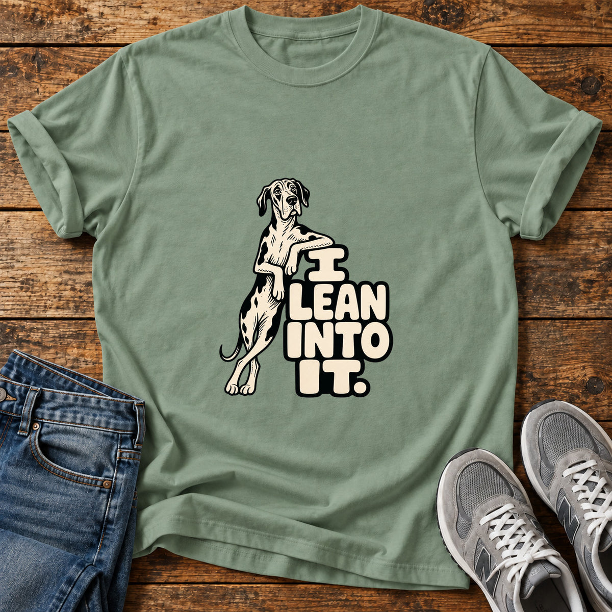 Lean Into It Great Dane graphic T-shirt in Sage, shown on a flat-lay shirt mockup