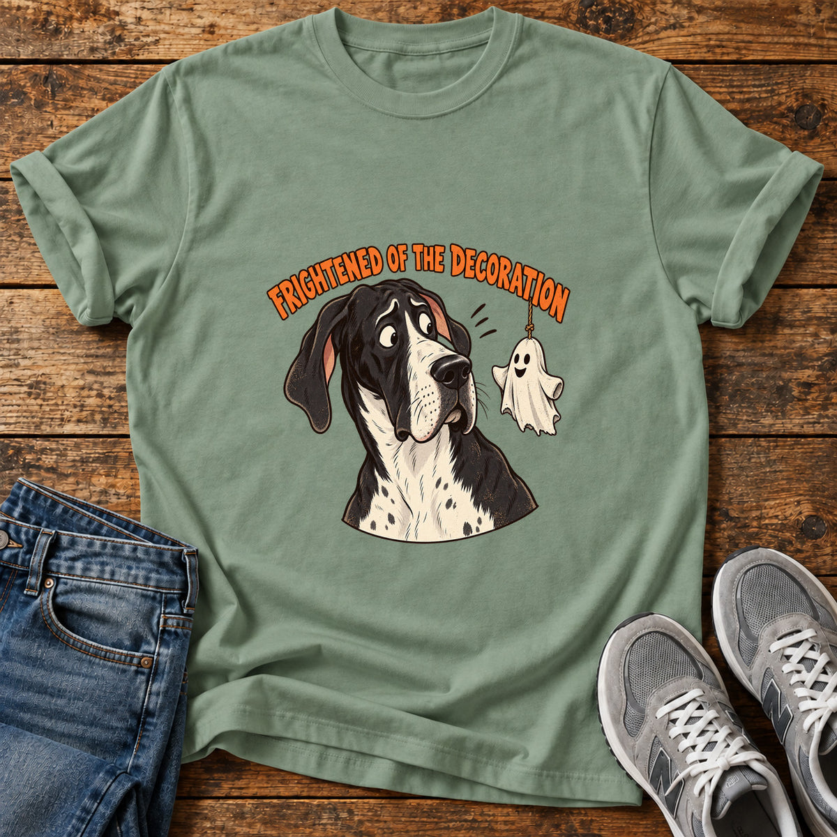 Frightened Decoration Great Dane graphic T-shirt in Sage, shown on a flat-lay shirt mockup