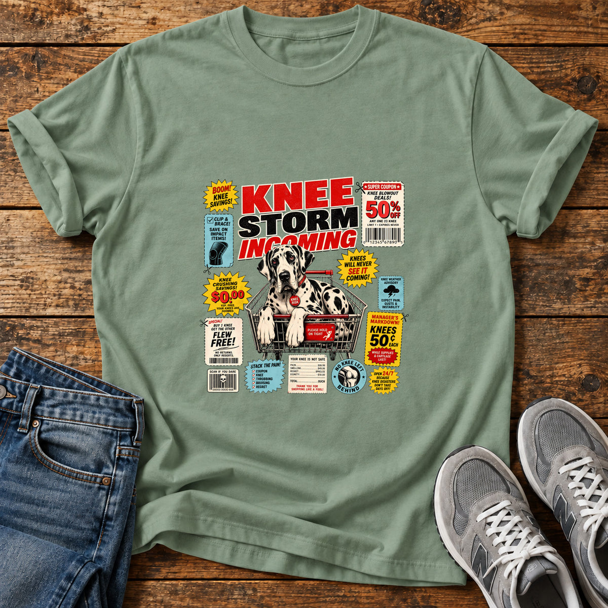 Knee Storm Incoming Great Dane graphic T-shirt in Sage, shown on a flat-lay shirt mockup