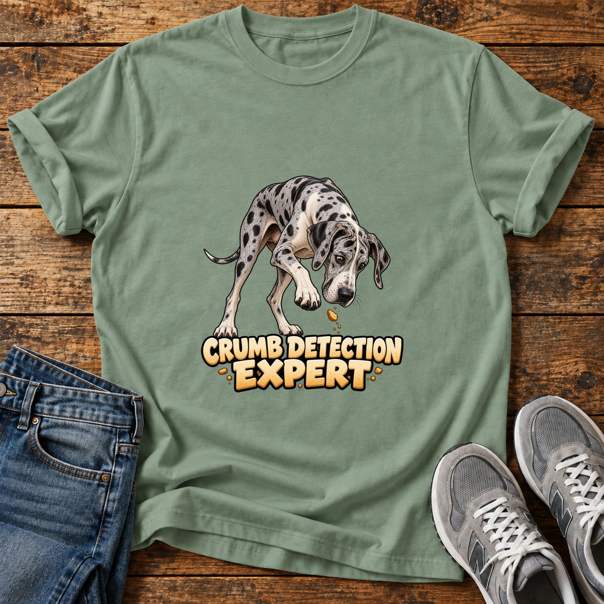 Crumb Detection Expert Great Dane graphic T-shirt in Sage, shown on a flat-lay shirt mockup