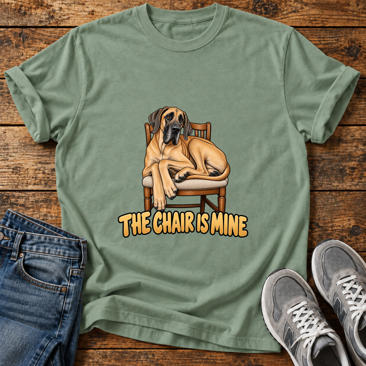 The Chair Great Dane graphic T-shirt in Sage, shown on a flat-lay shirt mockup