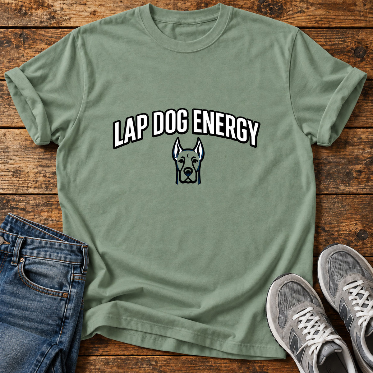 Lap Dog Energy Great Dane graphic T-shirt in Sage, shown on a flat-lay shirt mockup