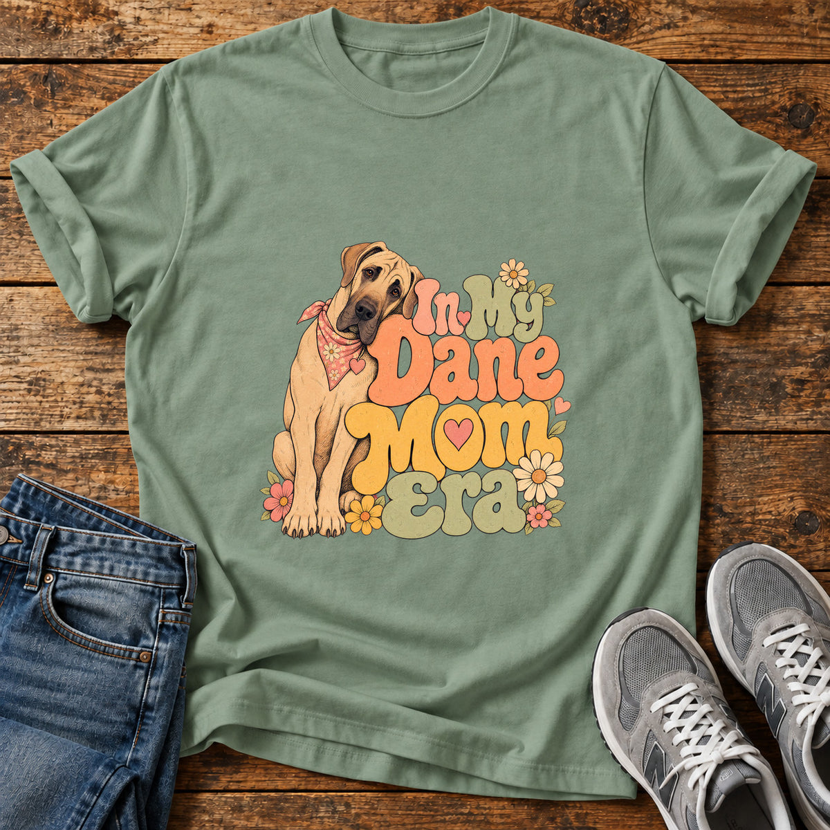 Dane Mom Era Great Dane graphic T-shirt in Sage, shown on a flat-lay shirt mockup