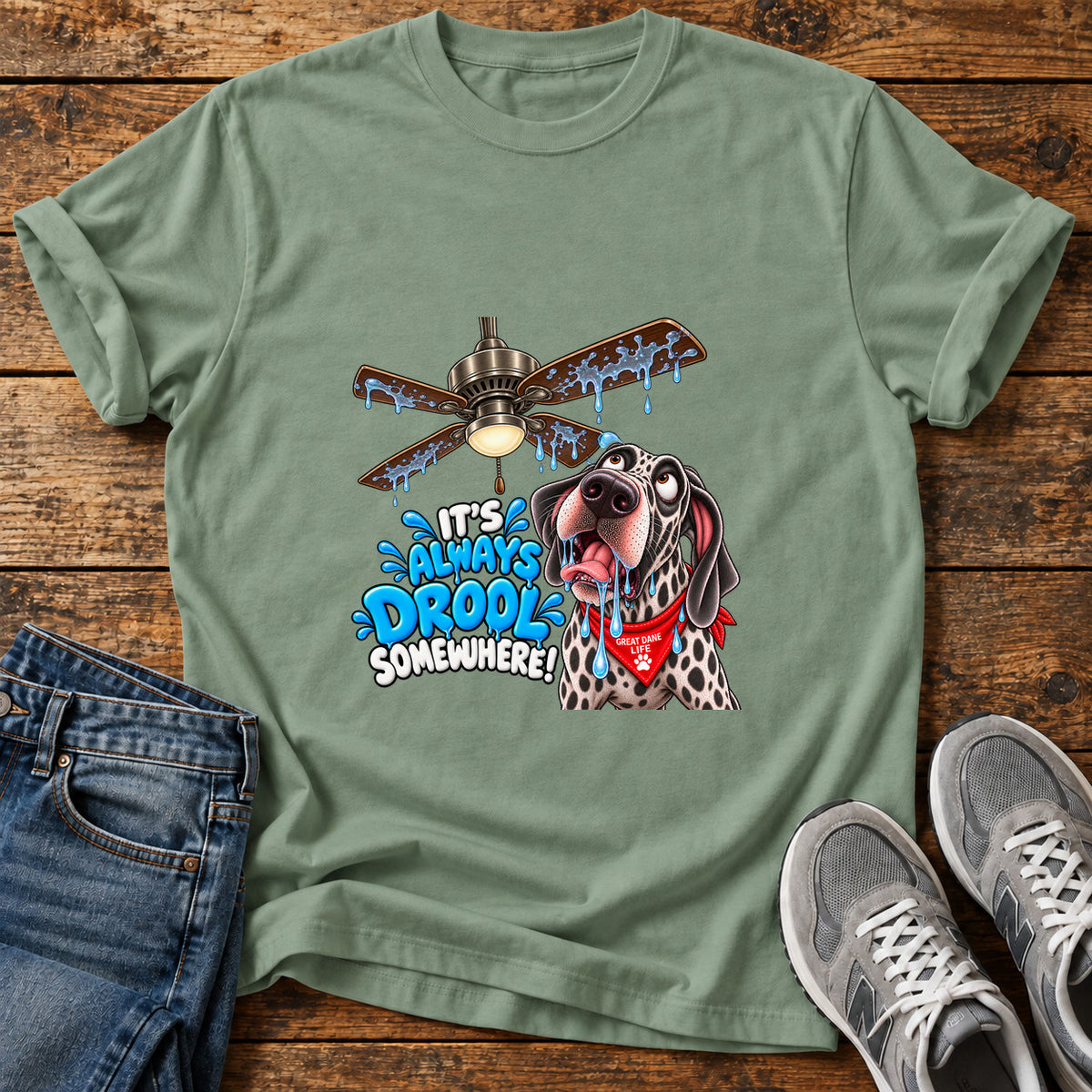 Drool Everywhere Great Dane graphic T-shirt in Sage, shown on a flat-lay shirt mockup
