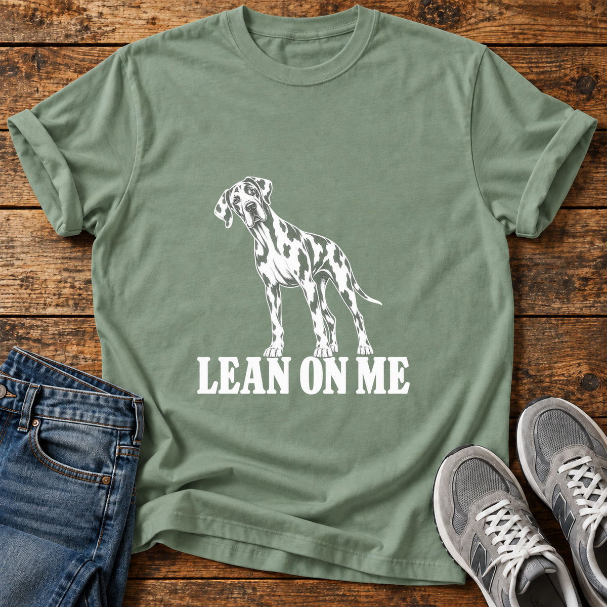 Lean On Me Great Dane graphic T-shirt in Sage, shown on a flat-lay shirt mockup