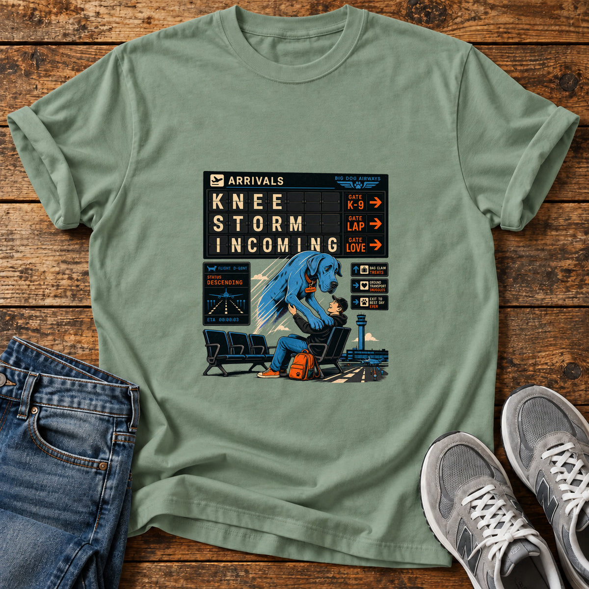 Knee Storm Incoming Great Dane graphic T-shirt in Sage, shown on a flat-lay shirt mockup