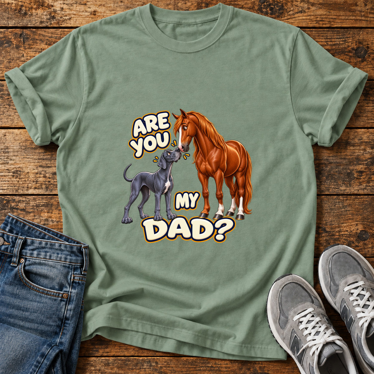 Are You Dad Great Dane graphic T-shirt in Sage, shown on a flat-lay shirt mockup