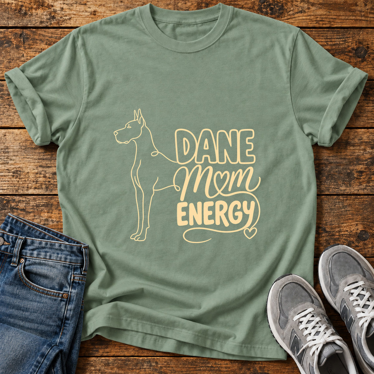 Dane Mom Vibes Great Dane graphic T-shirt in Sage, shown on a flat-lay shirt mockup