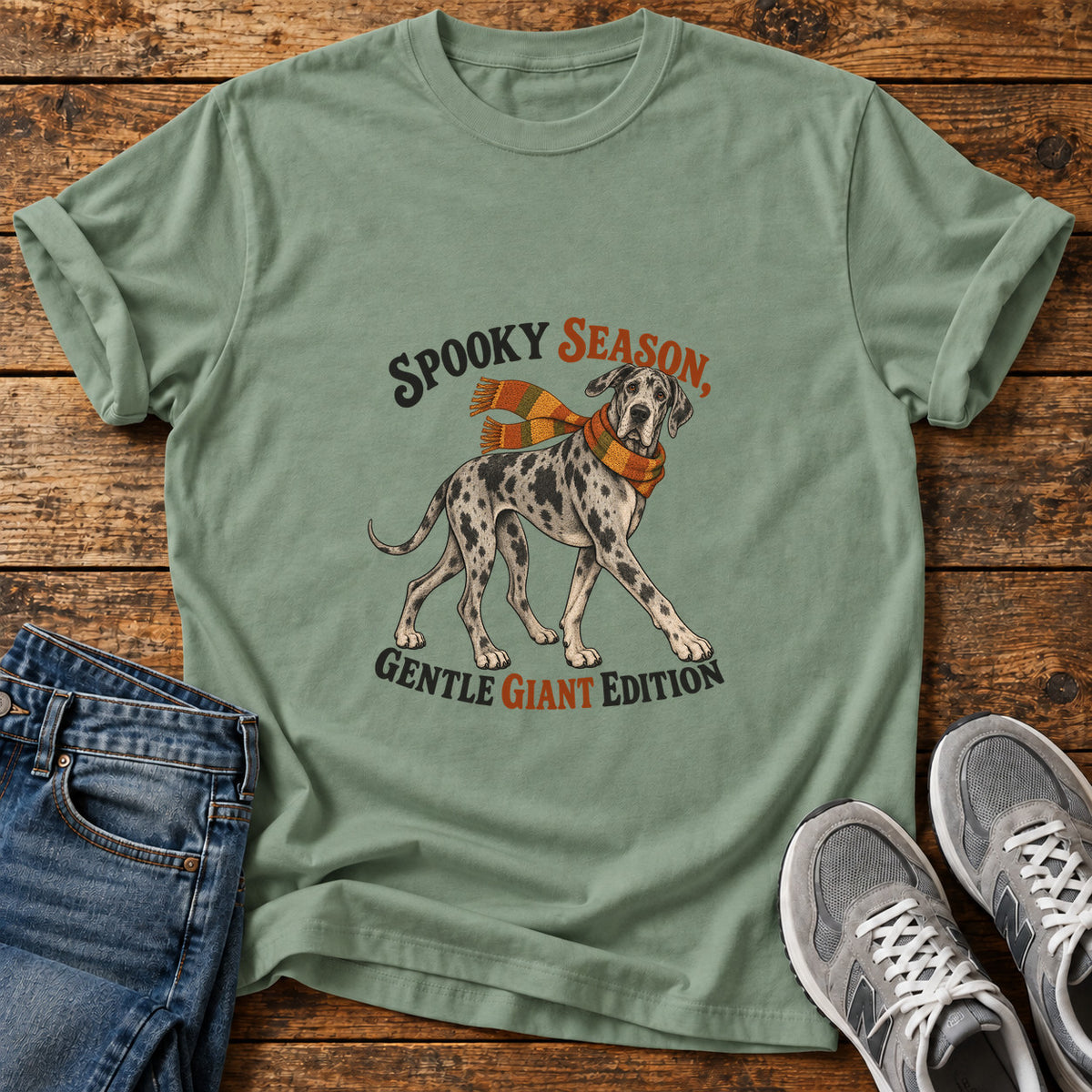 Spooky Giant Edition Great Dane graphic T-shirt in Sage, shown on a flat-lay shirt mockup